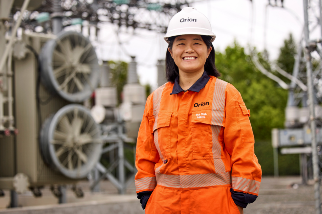 women working at orion wearing a high vis vest and a hard hat at a factory
